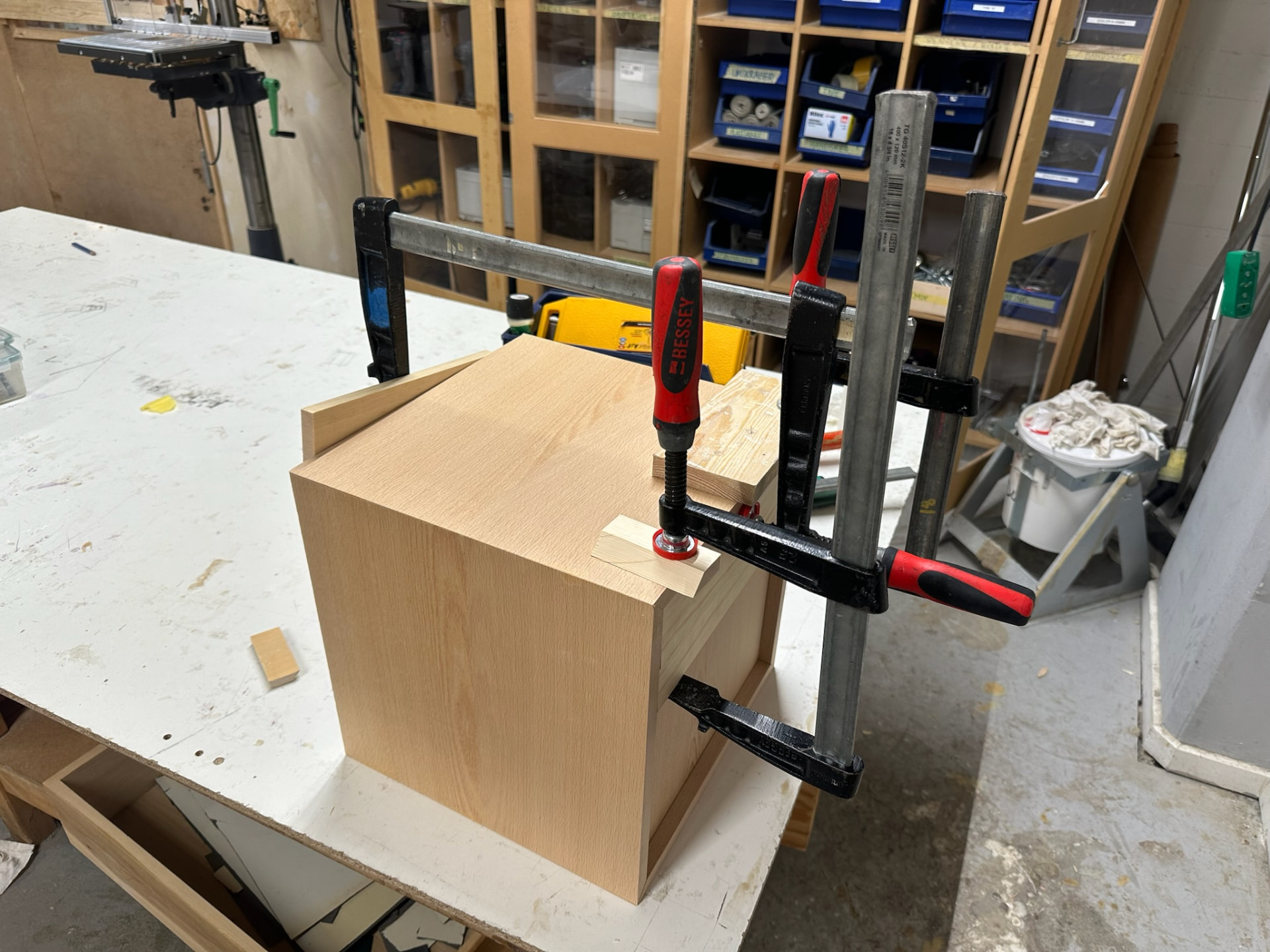 Beech carcass held in bar clamps on the bench during glue-up.